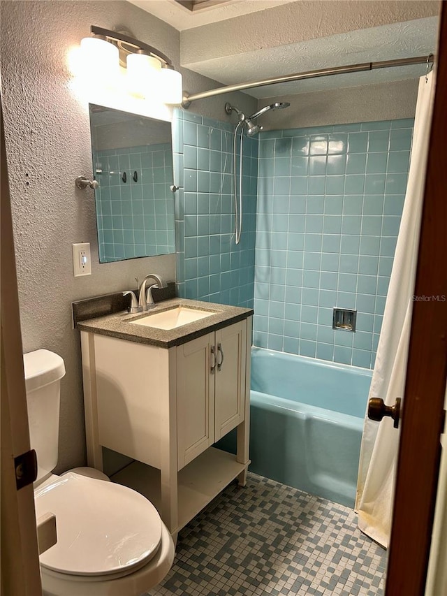 full bathroom featuring vanity, tile patterned flooring, toilet, a textured ceiling, and shower / tub combo