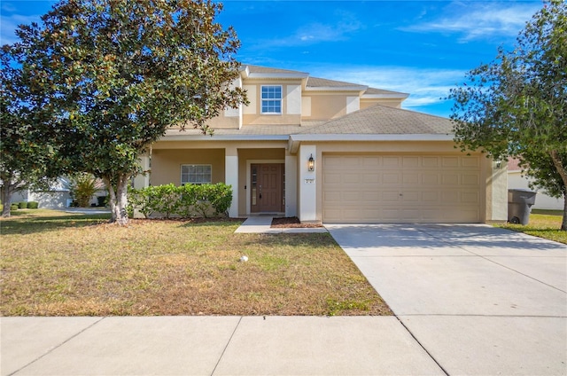 view of front facade with a garage and a front yard