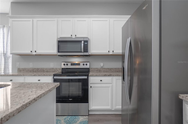 kitchen with white cabinetry and stainless steel appliances