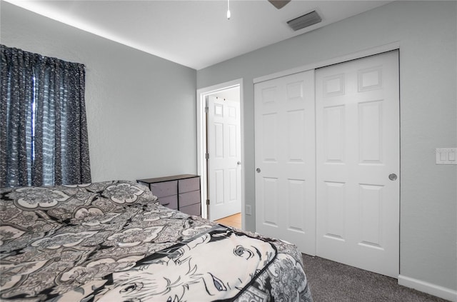 carpeted bedroom featuring a closet