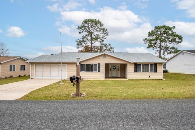 ranch-style home with a front lawn and a garage