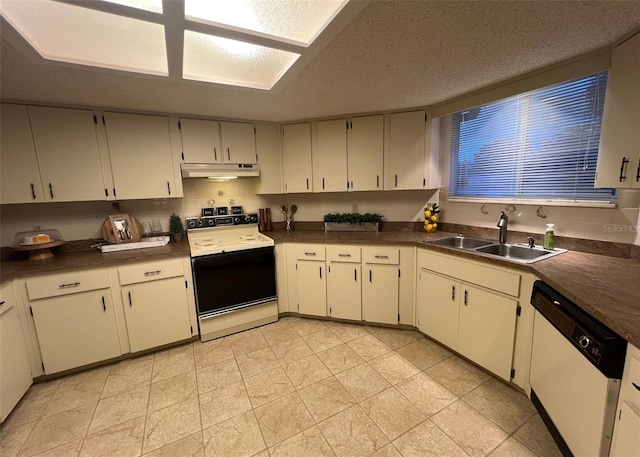 kitchen with white appliances, white cabinets, a textured ceiling, sink, and light tile patterned flooring