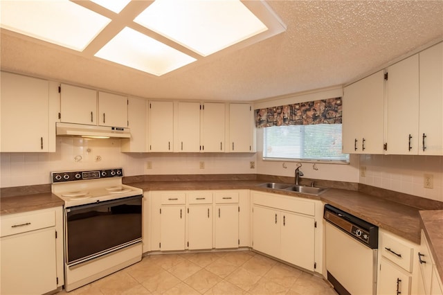 kitchen with white cabinetry, sink, white appliances, and a textured ceiling