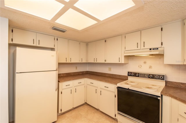 kitchen featuring decorative backsplash, electric stove, white cabinets, and white fridge