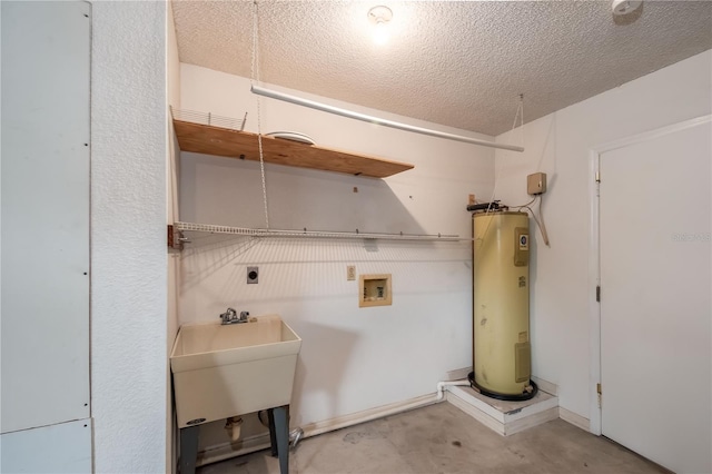 laundry area with electric water heater, sink, hookup for a washing machine, a textured ceiling, and hookup for an electric dryer