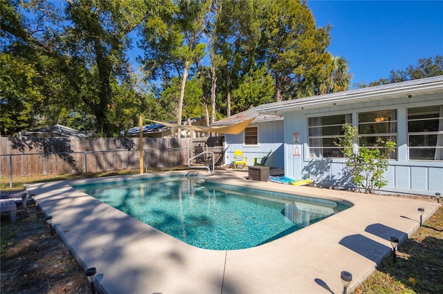 view of swimming pool featuring a patio