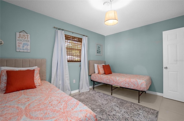 bedroom featuring light tile patterned floors