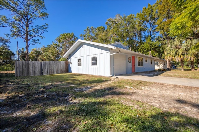 view of side of home featuring a garage