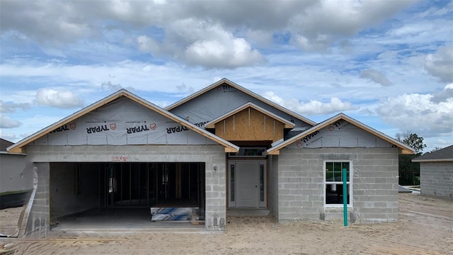 unfinished property featuring a garage