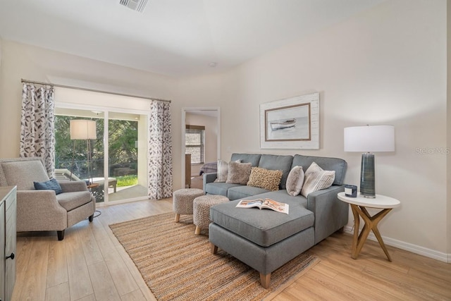 living room with light hardwood / wood-style flooring