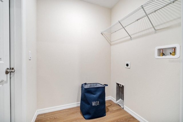 laundry area featuring washer hookup, hardwood / wood-style floors, and electric dryer hookup