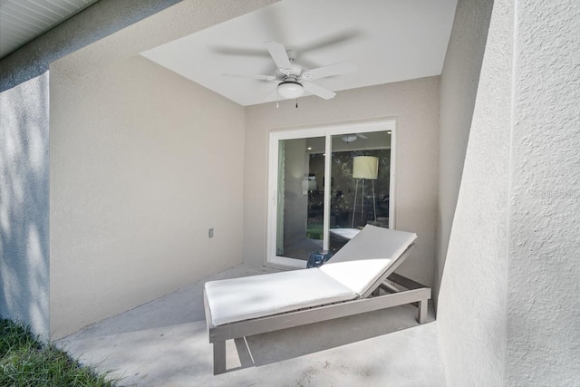 view of patio featuring ceiling fan