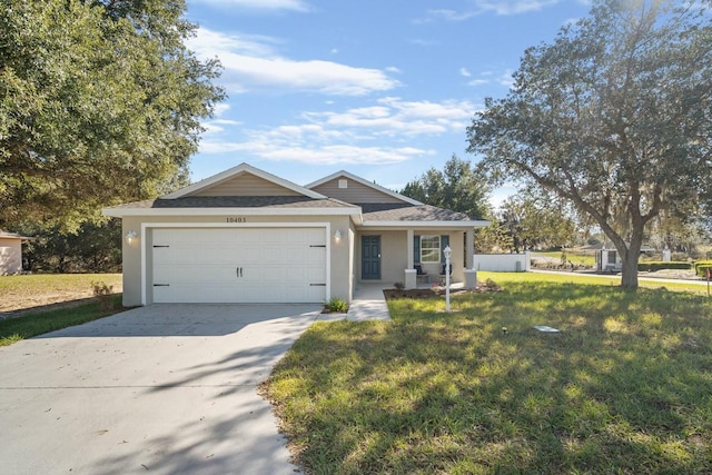 ranch-style house with a front lawn and a garage