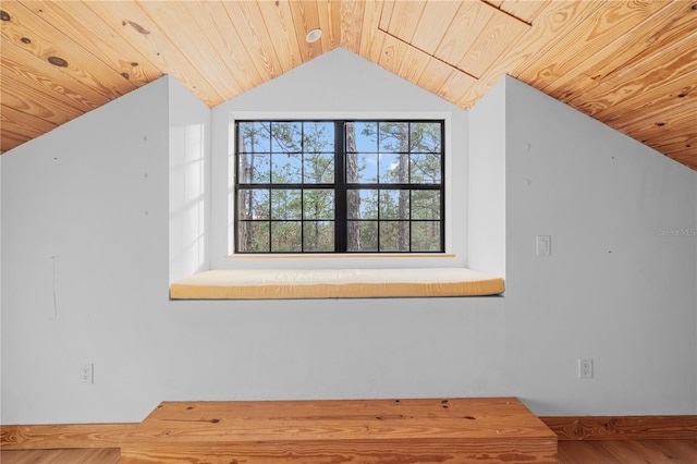 additional living space with wooden ceiling, vaulted ceiling, and wood-type flooring