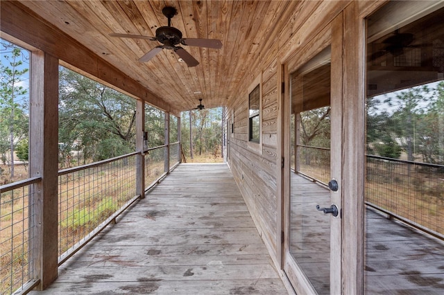 wooden terrace featuring ceiling fan