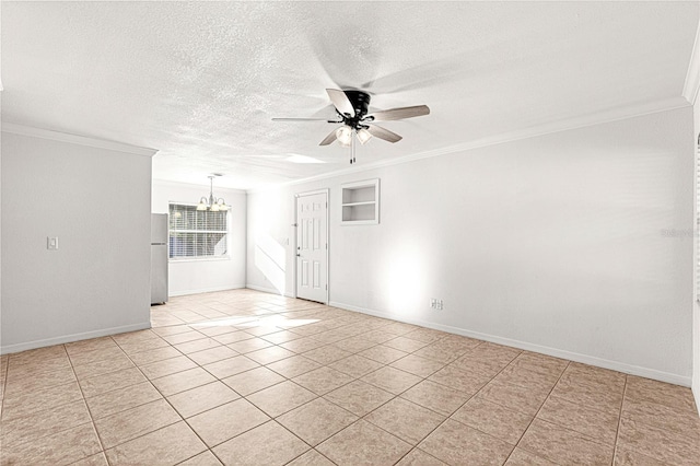 empty room featuring a textured ceiling, ceiling fan with notable chandelier, light tile patterned floors, and ornamental molding