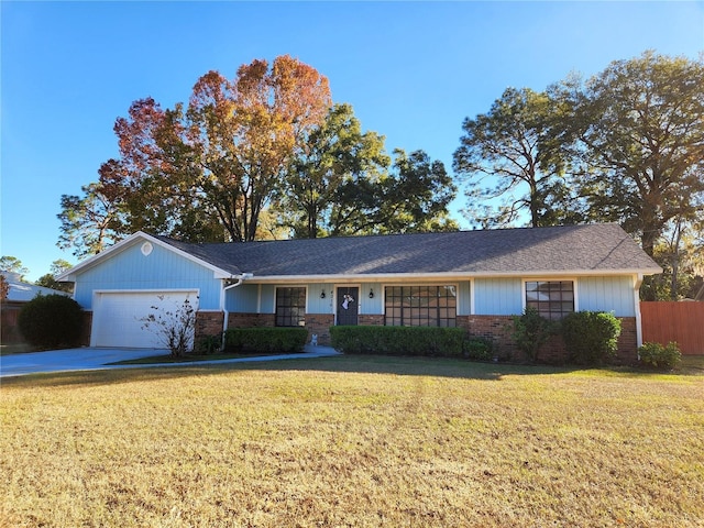 ranch-style house featuring a front yard and a garage