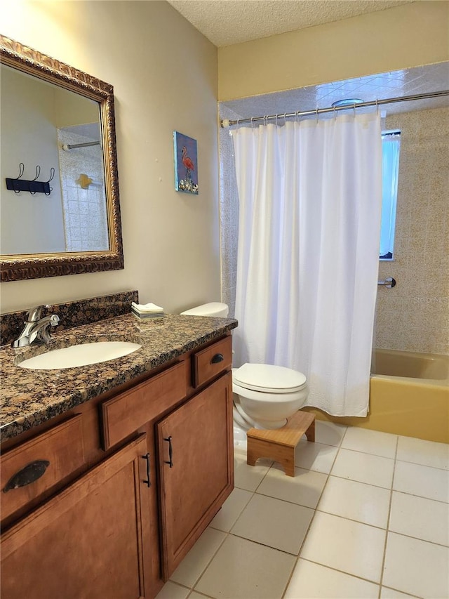 full bathroom with shower / tub combo, tile patterned floors, vanity, a textured ceiling, and toilet