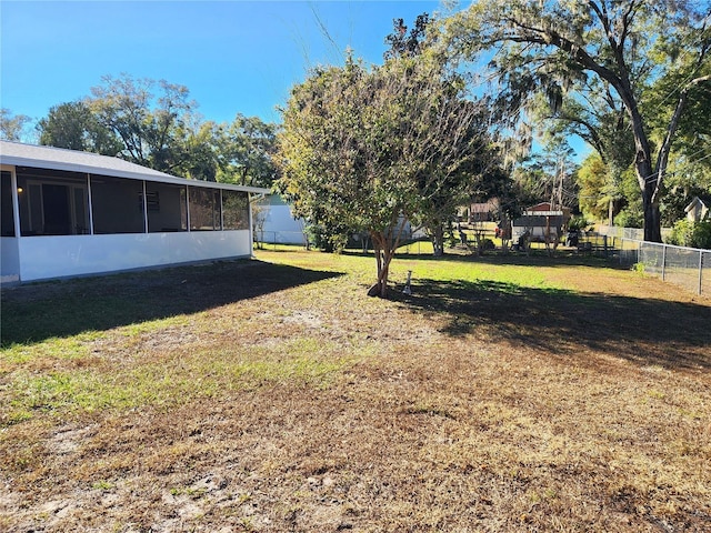 view of yard featuring a sunroom