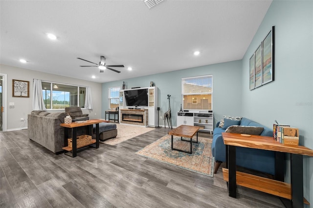 living room with ceiling fan and wood-type flooring