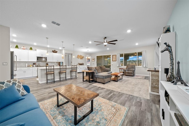 10564 SW 98th Ln, Ocala, FL 34481 - living room featuring recessed lighting, a ceiling fan, and light wood-style flooring