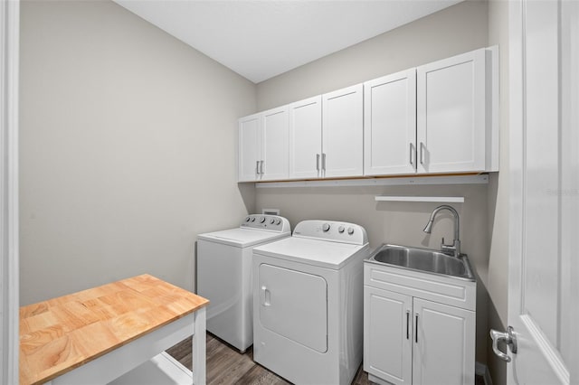 10564 SW 98th Ln, Ocala, FL 34481 - laundry room with independent washer and dryer, cabinet space, and wood finished floors