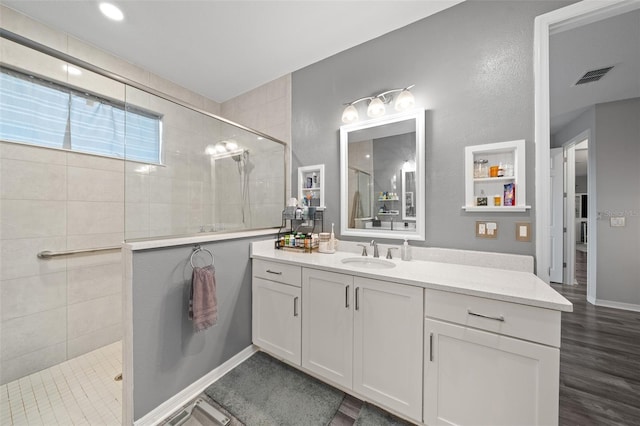 10564 SW 98th Ln, Ocala, FL 34481 - full bathroom featuring a walk in shower, vanity, and wood finished floors