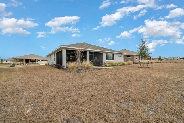 10564 SW 98th Ln, Ocala, FL 34481 - rear view of property featuring a sunroom