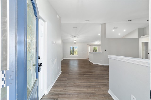 foyer with hardwood / wood-style flooring and lofted ceiling