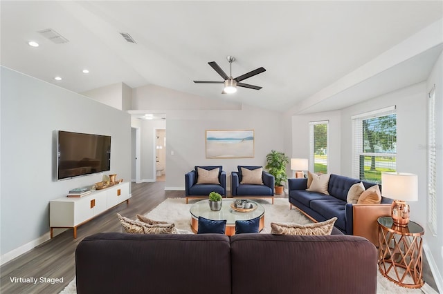 living room with ceiling fan, dark hardwood / wood-style flooring, and vaulted ceiling