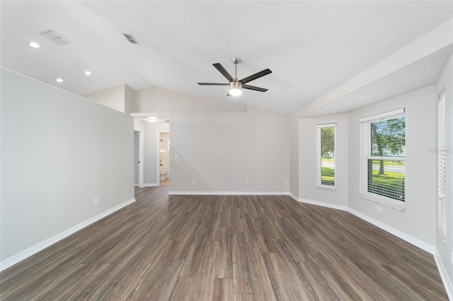 empty room featuring dark hardwood / wood-style flooring, ceiling fan, and lofted ceiling