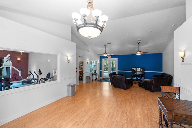 living room with lofted ceiling, light hardwood / wood-style flooring, french doors, and ceiling fan