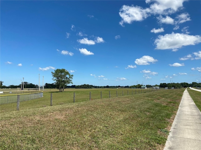 view of yard with a rural view