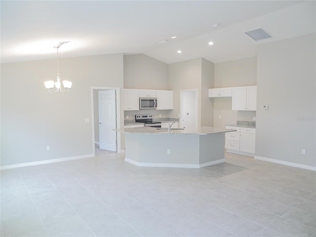 kitchen with stainless steel appliances, white cabinetry, hanging light fixtures, and an island with sink