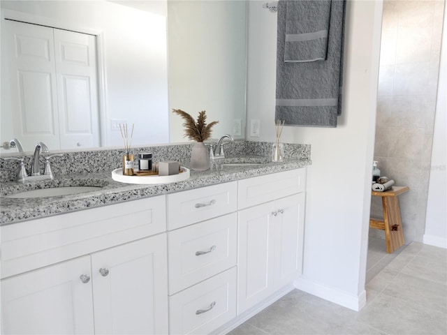 bathroom featuring tile patterned floors and vanity