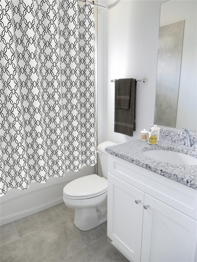 full bathroom featuring vanity, shower / bath combo, and toilet