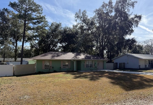 ranch-style home with a front lawn