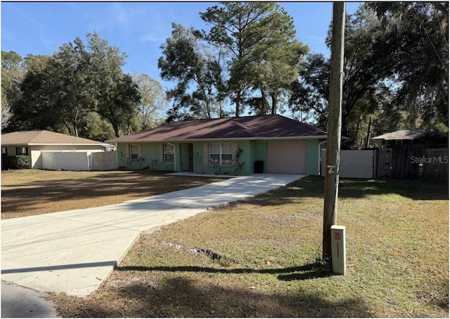 ranch-style home with a garage and a front yard