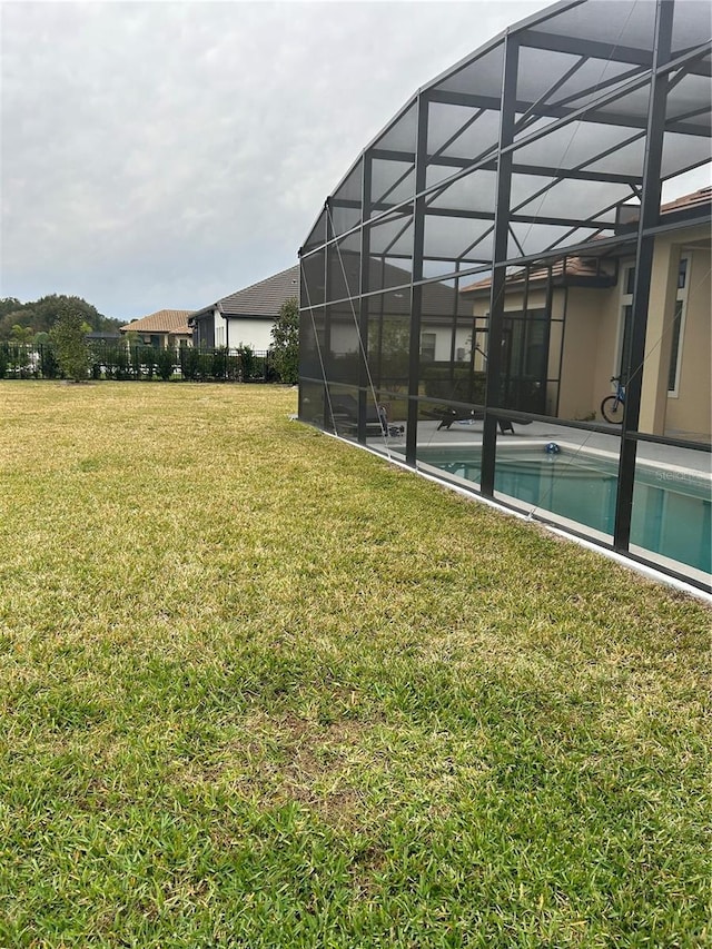 view of yard with a lanai