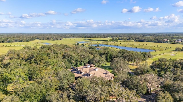 birds eye view of property with a rural view and a water view