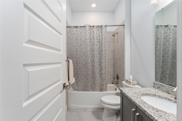 full bathroom with shower / bathtub combination with curtain, vanity, tile patterned flooring, and toilet