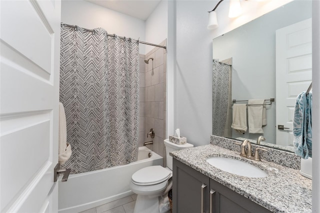 full bathroom featuring vanity, shower / bath combination with curtain, tile patterned floors, and toilet