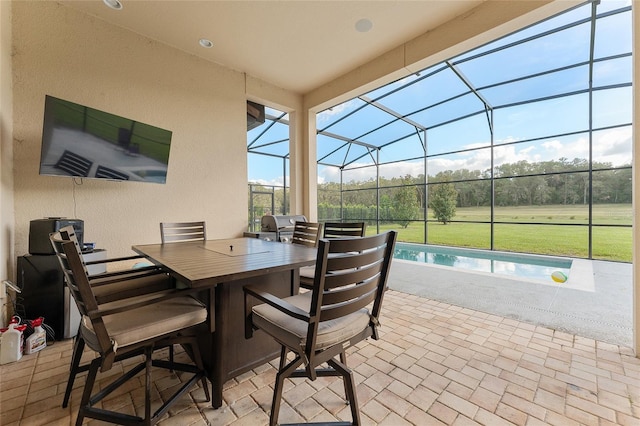 view of patio / terrace with a lanai