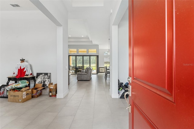 entryway with light tile patterned floors