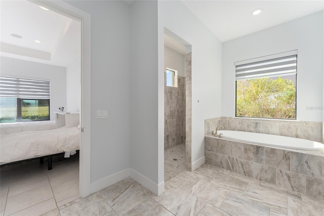 bathroom with separate shower and tub