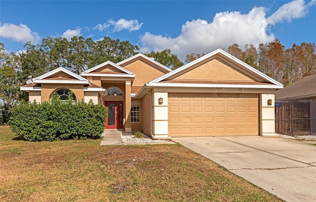 ranch-style house with a garage and a front lawn