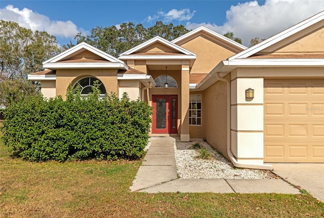 view of exterior entry featuring a garage