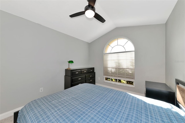 carpeted bedroom with ceiling fan and lofted ceiling