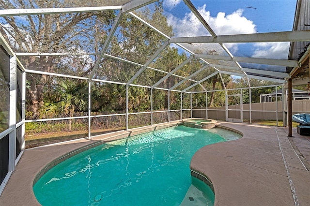 view of swimming pool featuring a lanai, a patio area, and an in ground hot tub