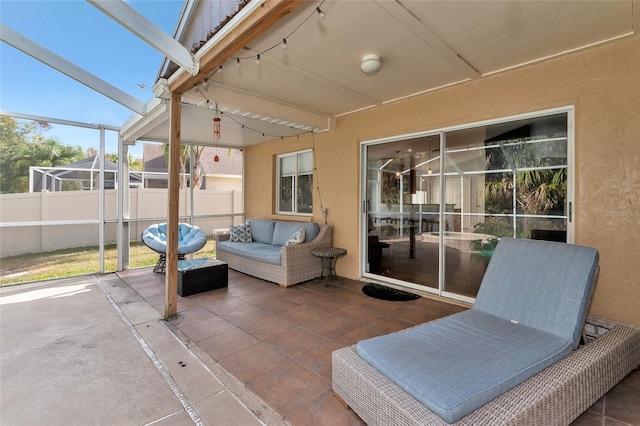 view of patio featuring a lanai